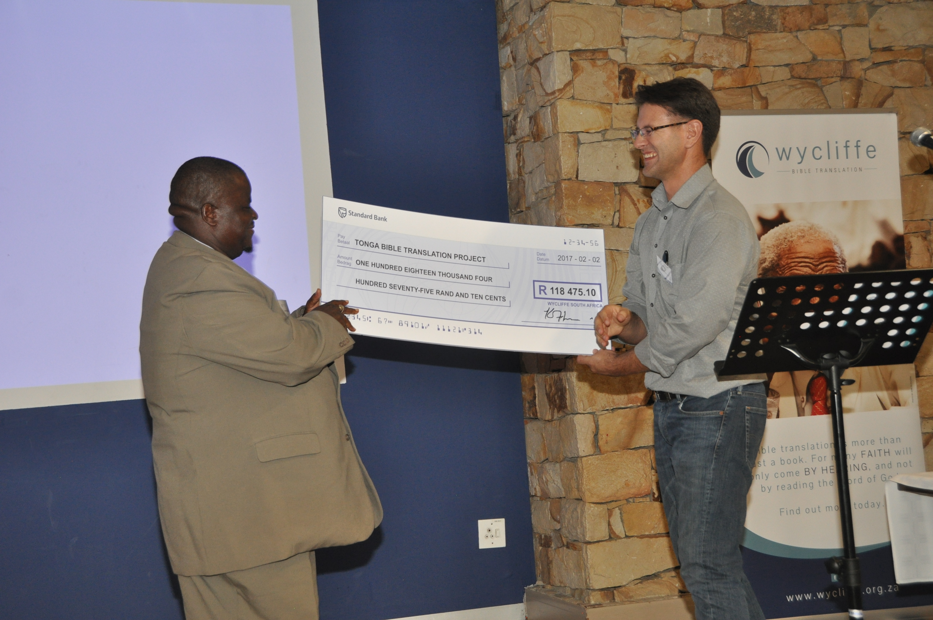 AFRICA ALIVE CYCLE TEAM HANDS OVER CHEQUE